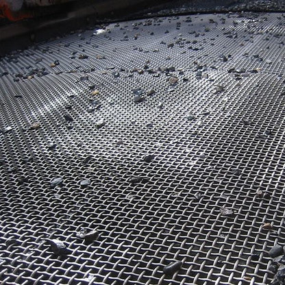 crimped wire mesh panel installed in a vibrating screen machine at a quarry
